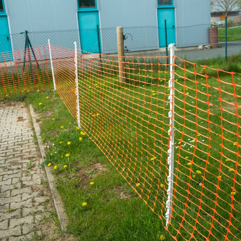 Hotline 50m Plastic Fencing Mesh Roll Orange in use