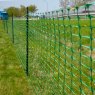 Hotline 50m Plastic Fencing Mesh Roll Green in use