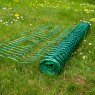 Hotline 50m Plastic Fencing Mesh Rolled up on grass